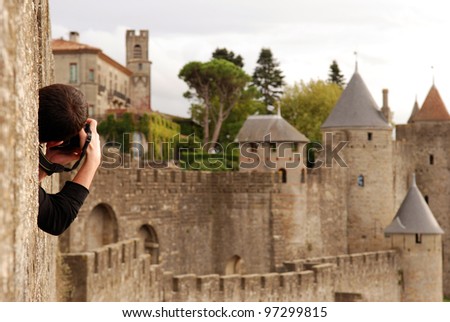 Man taking a picture of Carcassonne castle