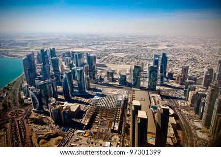 Aerial view on Doha - capital of  Qatar.  Contemporary towers on Doha Corniche in November 2011. Royalty-Free Stock Photo #97301399