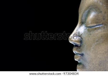 Buddha isolated profile on black background