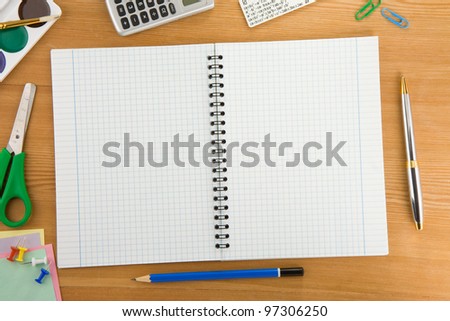 back to school concept and supplies on wood background