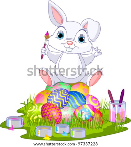 Cute Easter bunny sitting on eggs