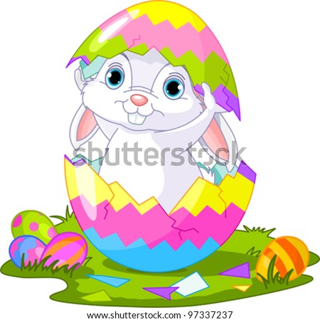 Cute Easter bunny jumping out from broken egg