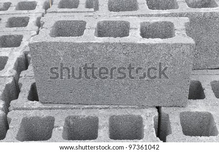 Stack of concrete bricks at warehouse in Thailand Royalty-Free Stock Photo #97361042