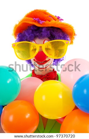 portrait of child dressed as colorful funny clown over white background