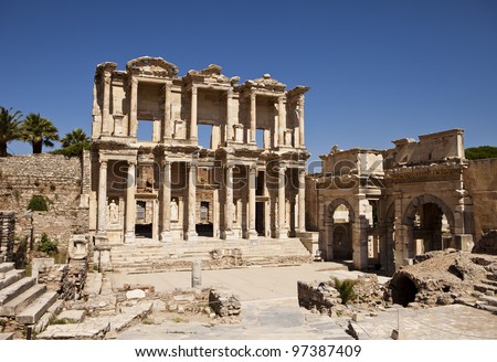 The front facade and courtyard of the Library of Celsus at Ephesus is an ancient Greek and Roman structure. Reconstructed by archaeologists from old stones, it is near the city of Izmir in Turkey. Royalty-Free Stock Photo #97387409