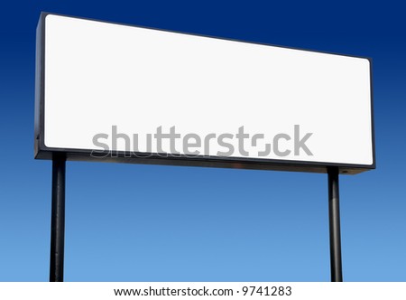 Long white billboard and a blue sky.