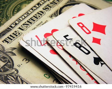 Playing cards and dollars.