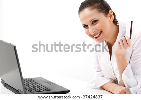 Portrait of a happy  woman with business card against white background
