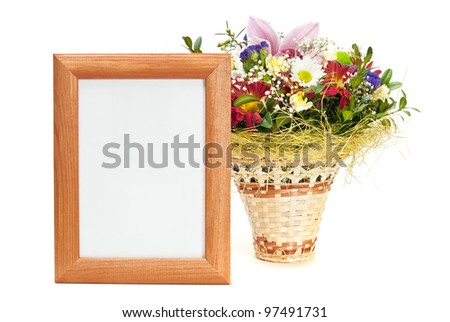 Wooden picture frame with flowers on white background