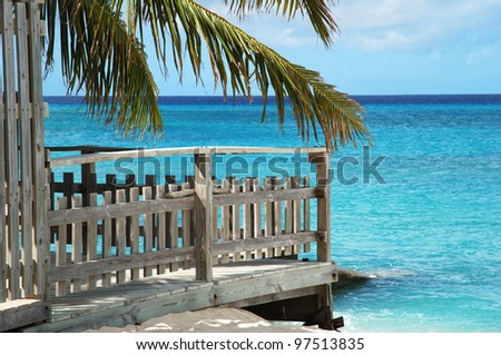 Details of a wooden structure standing straight on Cockburn Town beach (Grand Turk island, Turks & Caicos). Royalty-Free Stock Photo #97513835