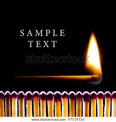 It is a lot of matches on a black background. One match burns. Royalty-Free Stock Photo #97519316