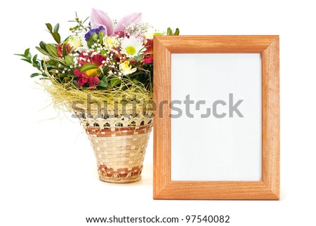 Wooden picture frame with flowers on white background