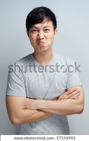 angry man cross his arms over his chest