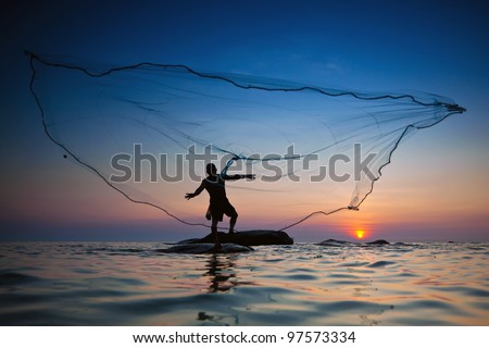 throwing fishing net during sunset , thai Royalty-Free Stock Photo #97573334