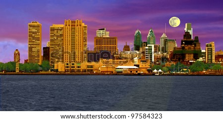 A view of Philadelphia, Pennsylvania's skyline at dusk for a colorful cityscape comprised of various commercial buildings.