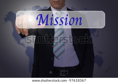 Hand of Business Man Pressing or Pushing Mission button