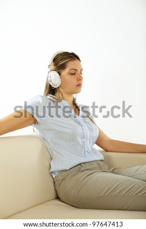 Portrait of a young cute woman listening to quiet music.