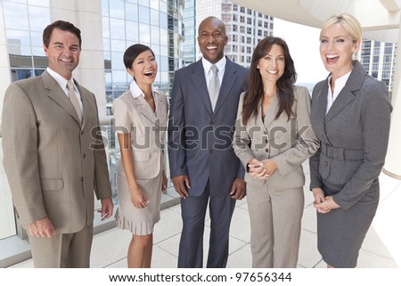 Happy laughing interracial group of business men & women, businessmen and businesswomen team