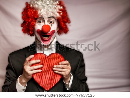 colorful clown with  a box of candy  on a white background Royalty-Free Stock Photo #97659125