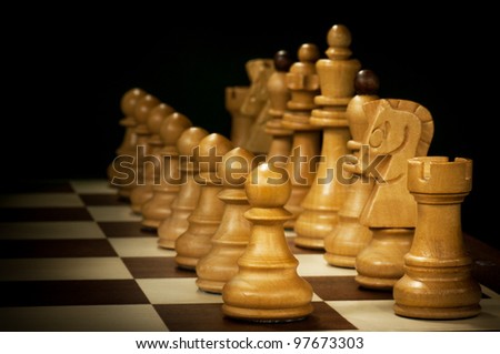 chess pieces isolated on a black background