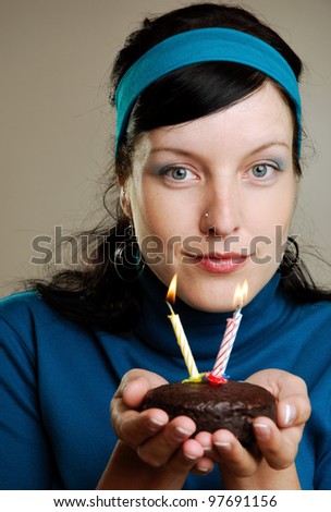 woman with a little birthday cake