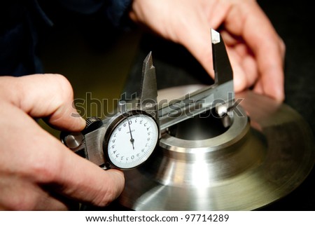 High precision measurement tools in a mechanics plant. Focus on the dial. Royalty-Free Stock Photo #97714289