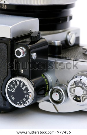 A close-up of the dials of a vintage SLR camera