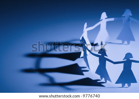 Cutout paper females standing holding hands. Royalty-Free Stock Photo #9776740