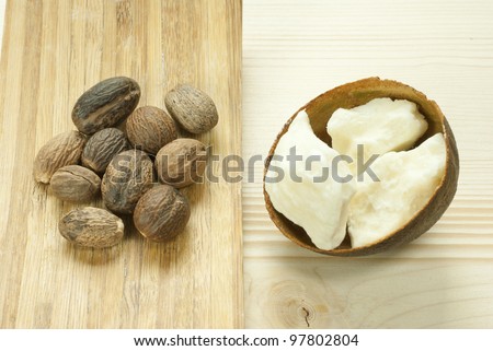 shea butter and shea butter nuts on wooden