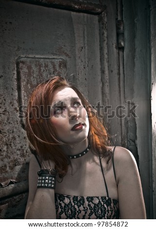 emo girl with beautiful hair on  Grunge background