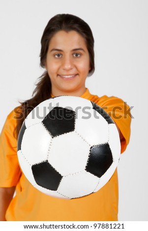 female referee with a soccer ball