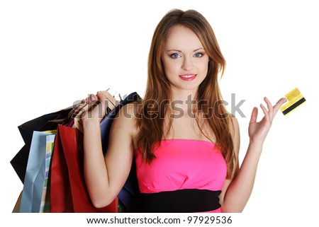 Woman with shopping bags holding credit card, isolated on white background