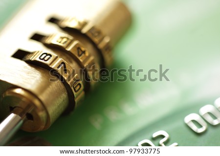 Credit card security concept with combination lock padlock