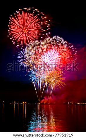 Colorful firework in a night sky Royalty-Free Stock Photo #97951919