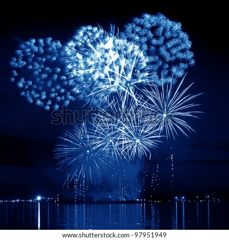 Blue firework in a night sky Royalty-Free Stock Photo #97951949