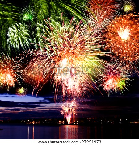 Colorful firework in a night sky Royalty-Free Stock Photo #97951973