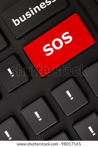 Button with sos text and wow symbols on the modern keyboard. Help concept