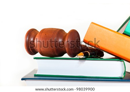 Books, folders, pen and gavel on a white background