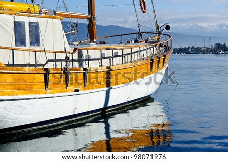 Colorful closeup picture of vintage sailing vessel at anchor