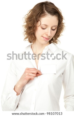 Beautiful young woman showing blank name badge, you can write your text on it; studio shot isolated on white