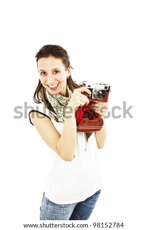 Portrait of a happy young girl with an old camera on white background