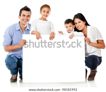 Family holding a banner and smiling - isolated over a white background