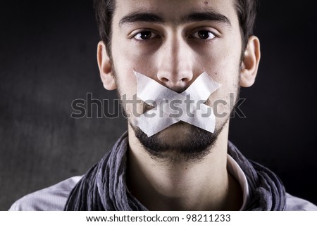 Man with tape over his mouth. Royalty-Free Stock Photo #98211233