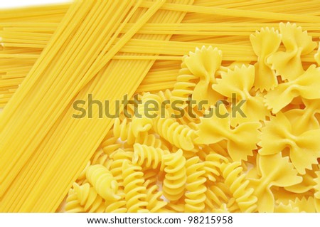 Closeup of frame of  italian pasta farfalle spaghetti isolated on white