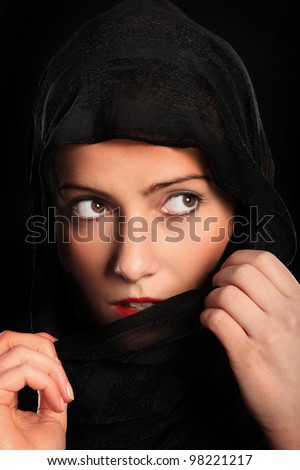 A picture of a young muslim girl over black background