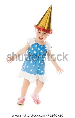 The little girl in the hat is dancing on a white background.