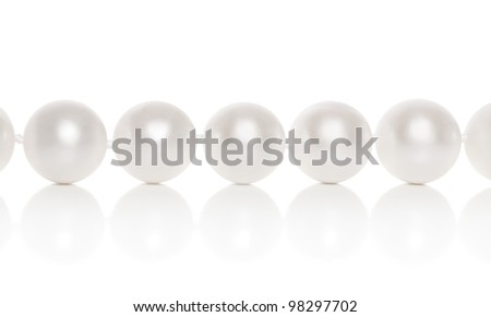 Pearl close-up on a white background with reflection Royalty-Free Stock Photo #98297702