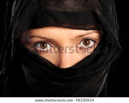 A picture of a young muslim woman over black background