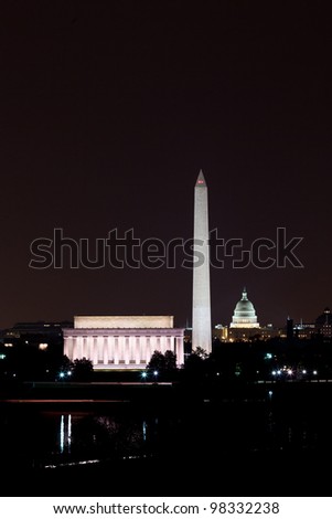 View of Washington DC skyline at night with lit up Lincoln Memorial, Washington Monument and the Capitol
