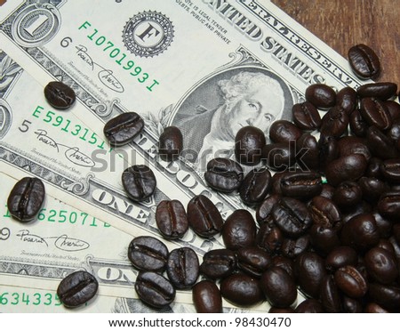 dollar bills and coffee beans